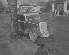 Old car tied in front of East Carolina College