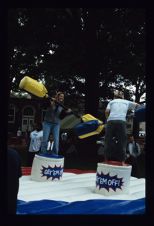 Two students jousting at Barefoot on the Mall