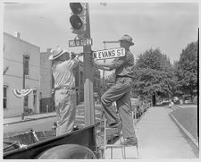 Putting up street signs 