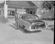 Highway patrolman and car 