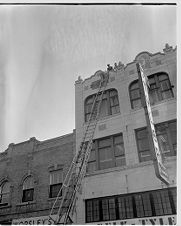 Firemen on top of Belk-Tyler 