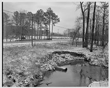 Snow by pond