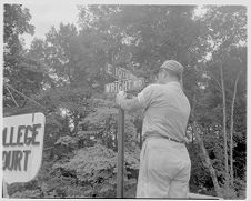 Man fixing street signs 