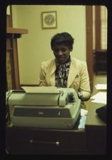 Woman using typewriter