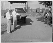 Patrolmen weighing trucks