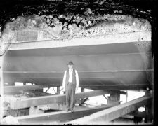 Unidentified man on wooden beam