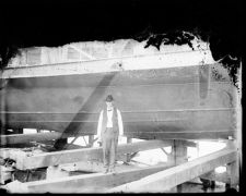 Unidentified man on wooden beam