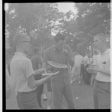 Men eating watermelon