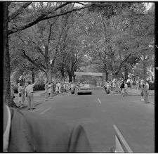 People waving to Kennedy motorcade