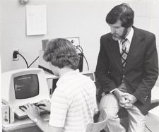 Gilmore and student at computer