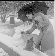 Woman making snowman