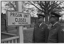 Guards looking at sign