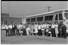 People in Front of a Bus