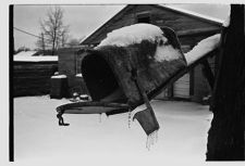 Mailbox covered in ice and snow