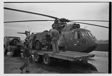 Helicopter and its Navy crew 