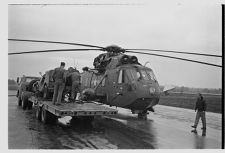 Helicopter and its Navy crew