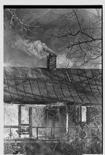 Firemen burning old houses 
