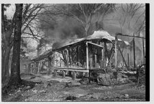 Firemen burning old houses 