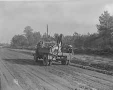 Men putting up electricity poles 