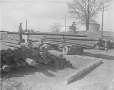 Men putting up electricity poles 