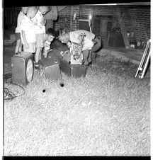 Man with children and movie projector 