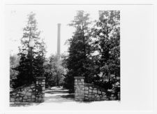 Davis Arboretum gate and Power Plant smokestack 