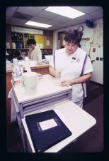 Nursing student using a mortar and pestle