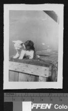 Kitten with monkey aboard ship