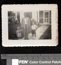 Leo Jenkins with boys in front of house