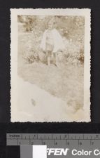 Young child in front of wildflowers