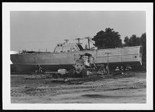 Osprey:  Portside view of boat on land