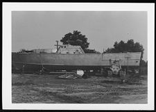 Osprey:  Portside view of boat on land