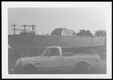 Osprey:  Portside view beside a truck.