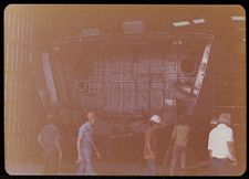 Men walking in front bulkhead under construction