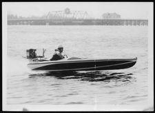 Small one/two person boat out on water. Collection :  Barbour #758 Misc. Photos.
