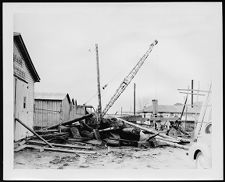 Msic. Photo.  Pile of scrap wood and crane