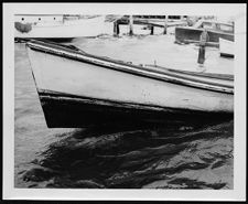 Misc. Photo.  Small boat tied to dock