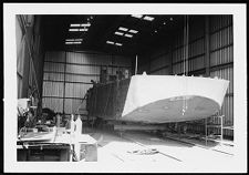 Boat under construction in a warehouse