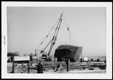 Boat under construction on a crane