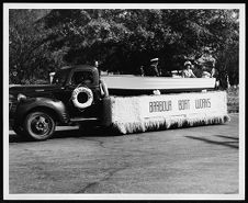 Parade float "Barbour Boat Works" with small motor boat.
