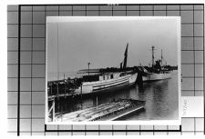 Exterior View- Starboard side of Unknown ship . And Portside of another unknown ship at dock.