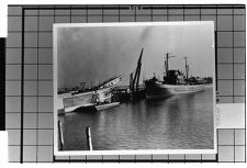 Exterior View- Starboard side of Unknown ship . And Portside of another unknown ship at dock.
