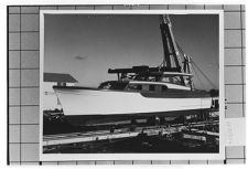 Portside view of small unknown boat on dry dock