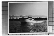 Portside view of unknown boat moving