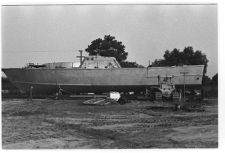 Osprey:  Portside view of boat on land