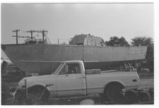 Osprey:  Portside view beside a truck.