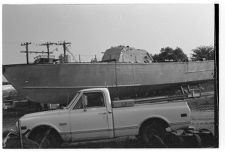 Osprey:  Portside view beside a truck.
