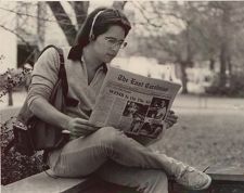 Student reading The East Carolinian