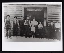 Men standing in front of buggy company