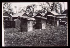 Row of shacks. Black and white photo. 